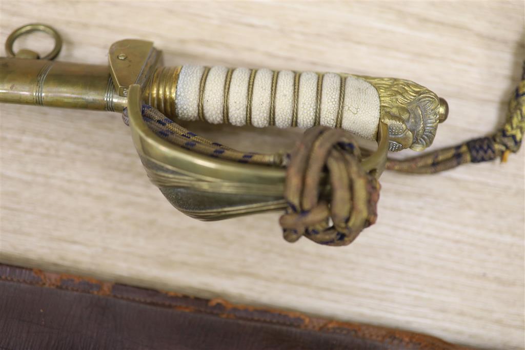A George V Naval officers sword, by J R Gaunt & Son, Serial No. 16427 together with scabbard and leather case